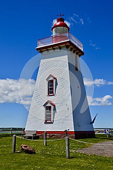 White clouds passing by Souris Lighthouse photo