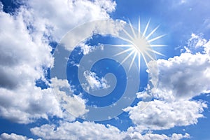 White Clouds and Star-shaped Sun in Blue Sky for Background