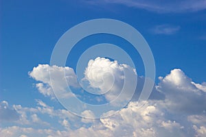 White clouds on a sunny day, against the blue sky