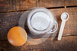 White Coarse Ground Salt On Wooden Table Background With Serving