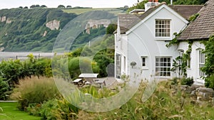 White coastal cottage in the English countryside style by the seaside