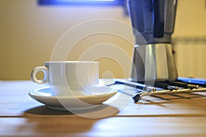 White Cofee cup in a wooden table