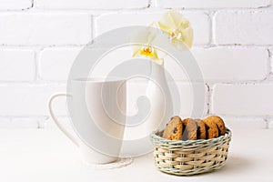 White coffee cappuccino mug mockup with soft yellow orchid in va