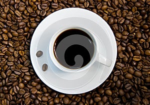 White coffee cup on the beans.