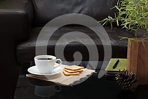 White coffee cup on glass table in living room