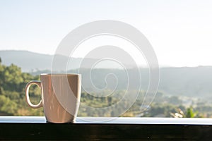 White coffee cup with mountain view