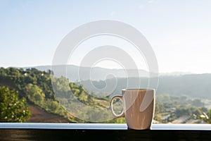 White coffee cup with mountain view