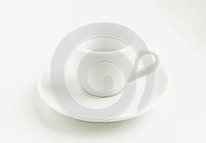 White coffee cup and saucer, empty coffee-free coffee cup, front view from above, or black coffee, on a white background