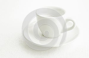 White coffee cup and saucer, empty coffee-free coffee cup, front view from above, or black coffee, on a white background
