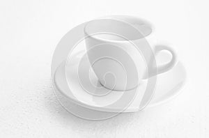 White coffee cup and saucer, empty coffee-free coffee cup, front view from above, or black coffee, on a white background,copy
