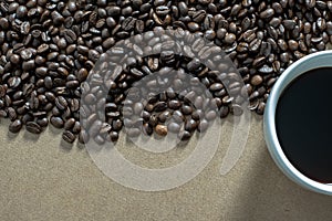 White coffee cups and coffee beans on the table.Top view