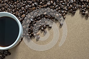 White coffee cups and coffee beans on the table.Top view