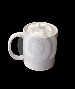 White coffee mug with frothed milk