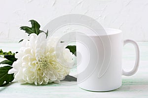 White coffee mug mockup with chrysanthemum