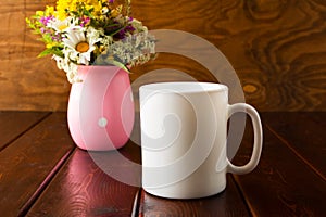 White coffee mug mockup with wild flowers