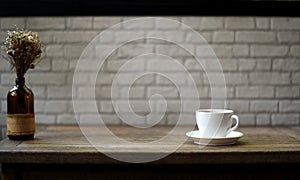 White coffee mug on a wooden table And white brick background