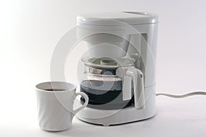 White coffeemaker, cup, isolated photo