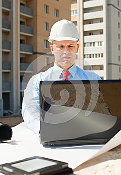 White-collar worker works on the building site