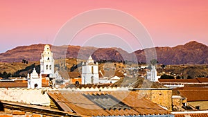 White colonial bell towers and orange rooftops in Sucre, Bolivia, South America