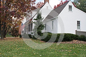 White colonial home in autumn