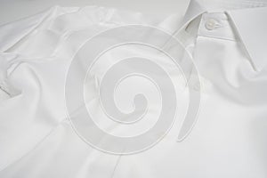 White color folded shirt background