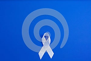White color ribbon for raising awareness on Lung cancer and Multiple Sclerosis and international day of non-violence against