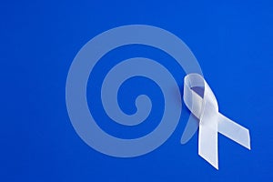 White color ribbon for raising awareness on Lung cancer and Multiple Sclerosis and international day of non-violence against women