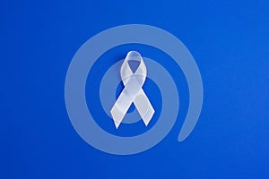 White color ribbon for raising awareness on Lung cancer and Multiple Sclerosis and international day of non-violence against women