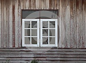 White color windows and old brown color wooden wall
