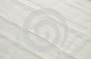 White color woven cotton gauze fabric background texture. close up top view