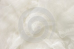 White color woven cotton gauze fabric background texture. close up top view