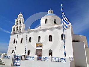 White Colored Church of Panagia of Platsani against Vivid Blue Sky at Oia Village, Greece