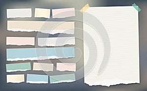 White and colorful ripped striped paper, notebook sheet for note or message stuck with sticky tape.