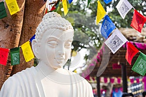 A white colour marble statue of Lord Buddha, founder of Buddhishm at Surajkund festival in Faridabad, India.