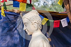 A white colour marble statue of Lord Buddha, founder of Buddhishm at Surajkund festival in Faridabad, India.