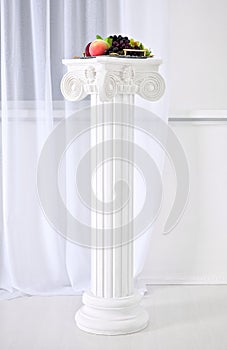 White columns with capitals in the style of Renaissance, Baroque.