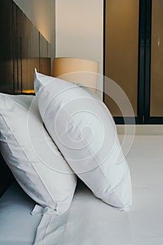 White comfortable pillow on bed