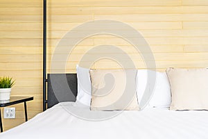 White comfortable pillow on bed decoration interior of bed room