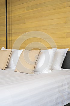 White comfortable pillow on bed decoration interior of bed room