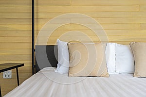 White comfortable pillow on bed decoration interior of bed room