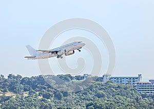 White commercial airplane flying take off from runway at Samui Airport, Samui island, Surat Thani, Thailand