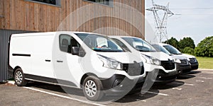 White commercial delivery vans in Warehouse Building