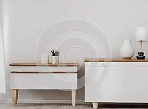 White commode with table lamp in bright minimalism interior style