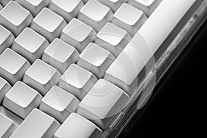 White computer keyboard. Technology and internet concept on black background