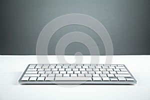 White computer keyboard on white desk