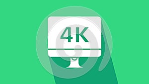 White Computer PC monitor display with 4k video technology icon isolated on green background. 4K Video motion graphic