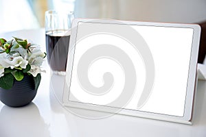 white computer tablet with isolated screen background table in cafe