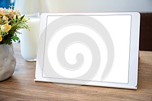 white computer tablet with isolated screen on table cafe