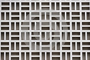 White concrete breeze block wall creating repeating geometric pattern