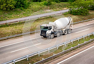 White concrete mixer or cement mixer truck